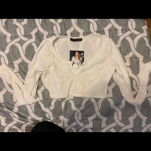 Cute crop top runs a little small.